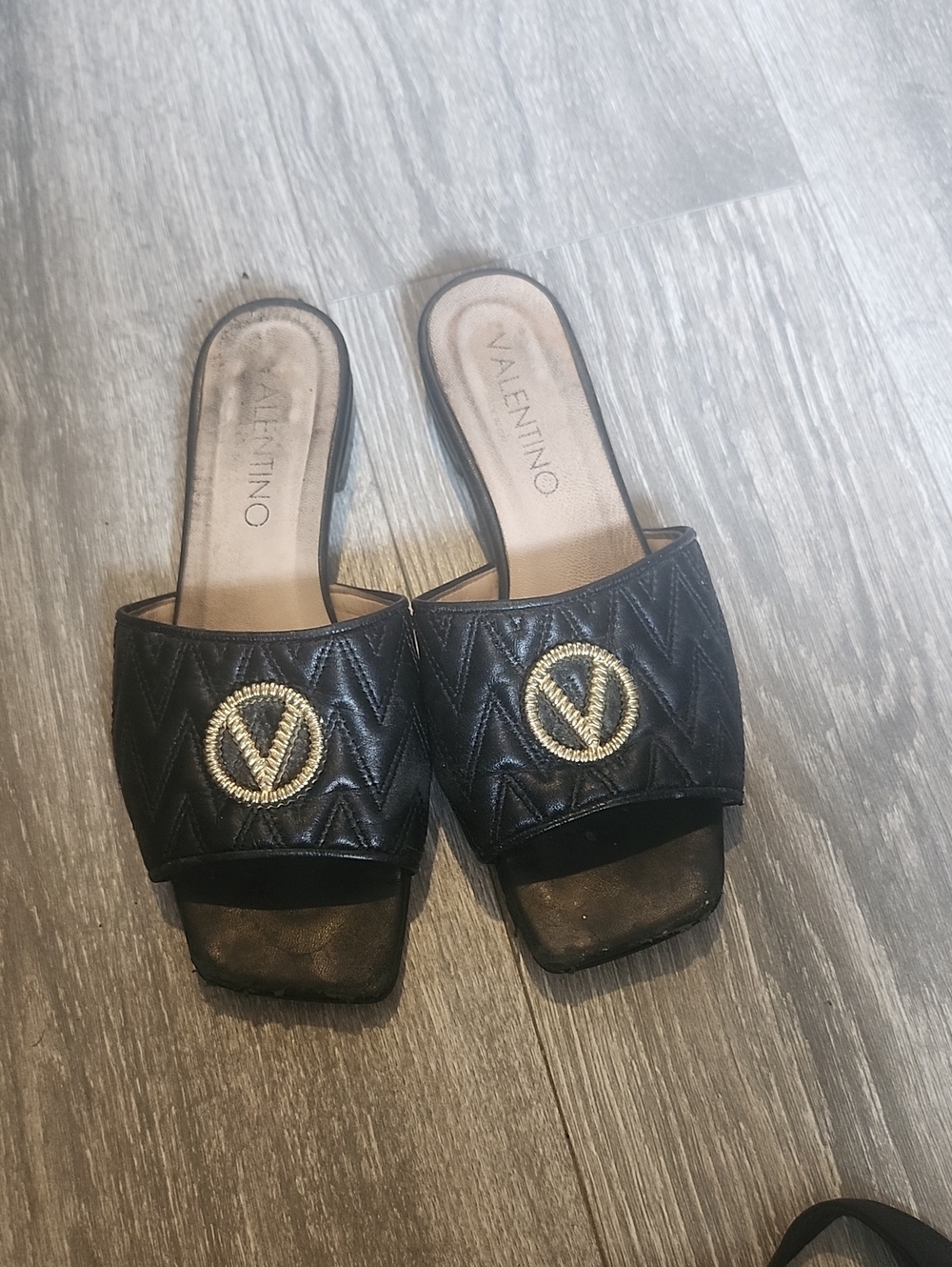 Valentino Black Quilted Slide Mules with Gold Emblem